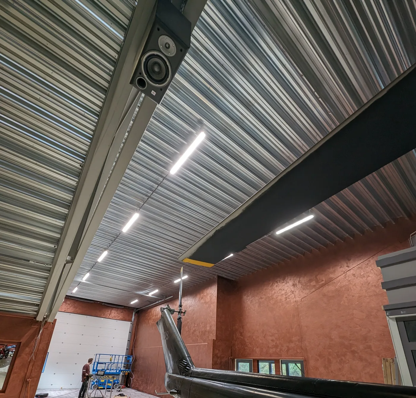 Hangar with helicopters under Apex lighting